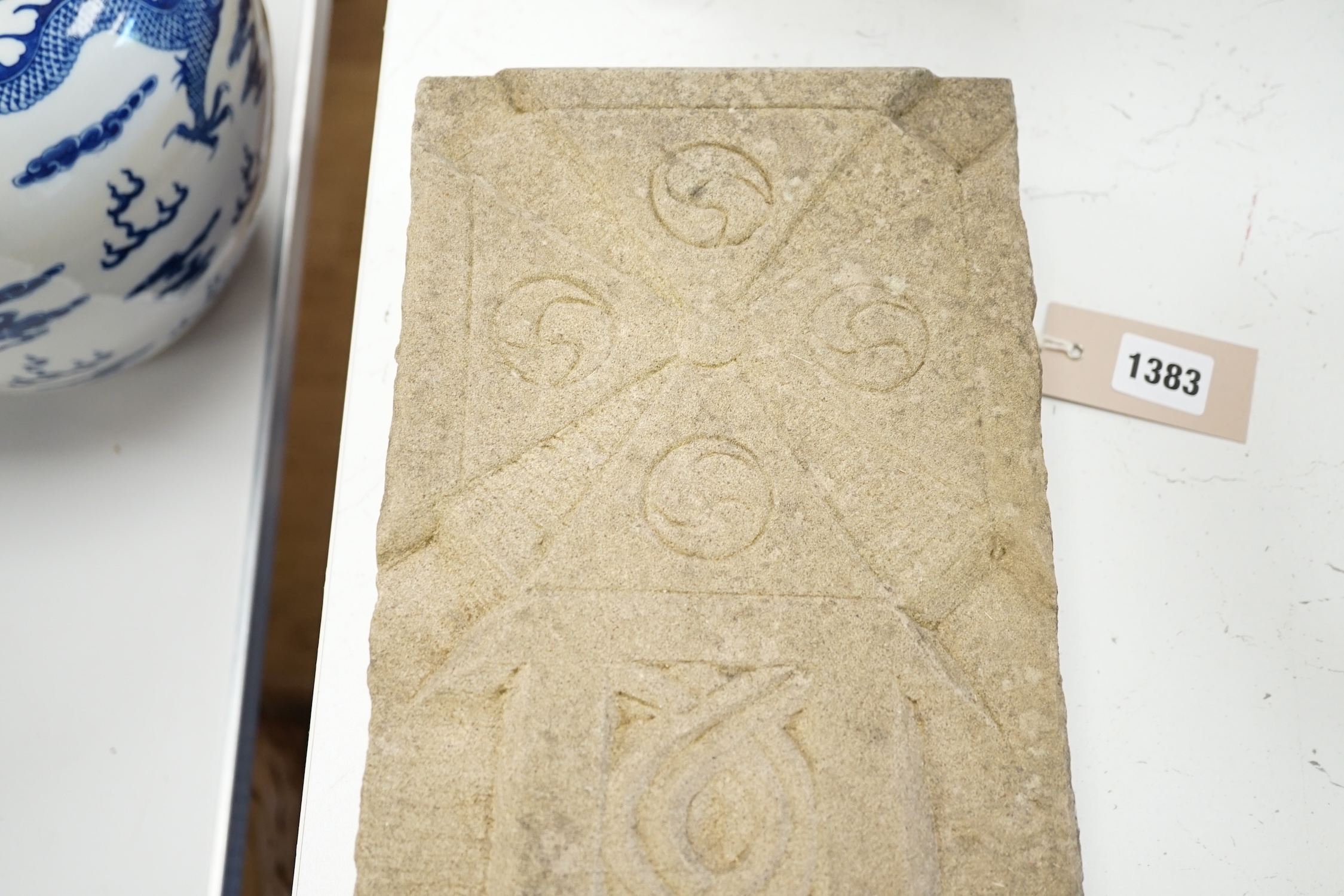 A carved stone Celtic cross, 56 x 18cm. Condition - good
